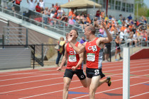 Senior Drew Jackson celebrates crossing the finish line with senior Timothy Shepherd as Shepherd takes the Iowa Conference title in the 3,000-meter steeplechase.