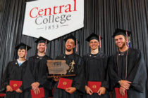 5 senior members of the Men's Track squad pose at graduation with their 2016 Iowa Conference championship trophy.