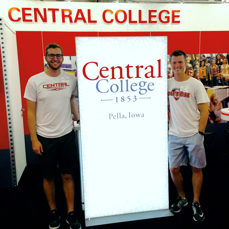 Roommates Rick Williamson ’15, left, and Grant Seuferer ’14, right, volunteering at the Central booth at the Iowa State Fair.