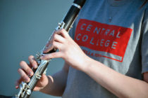 Student playing a clarinet at one of Central's music-focused camps.