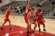 Central's Thomas Spoehr working under the basket in a game against Grinnell College.