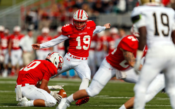 Jon Alberts ’20 kicking during a Central football game.