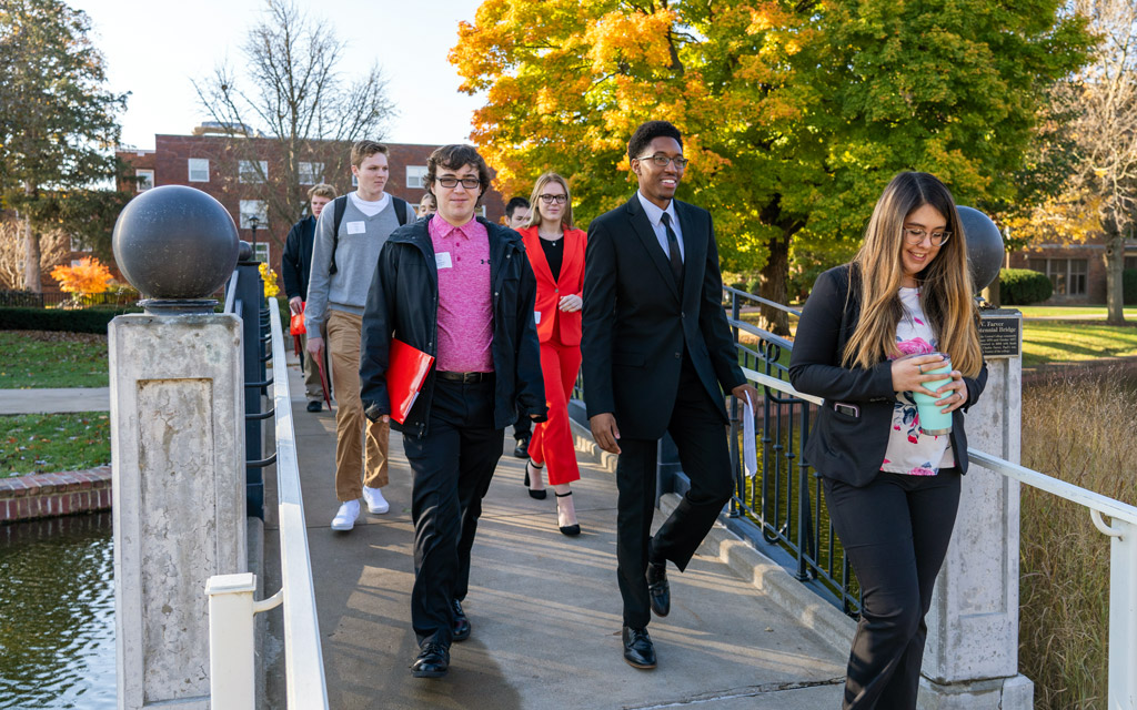 Jamel McKnight ’19, an admission representative at Central, leads students on a tour during Scholar Day in November 2019.