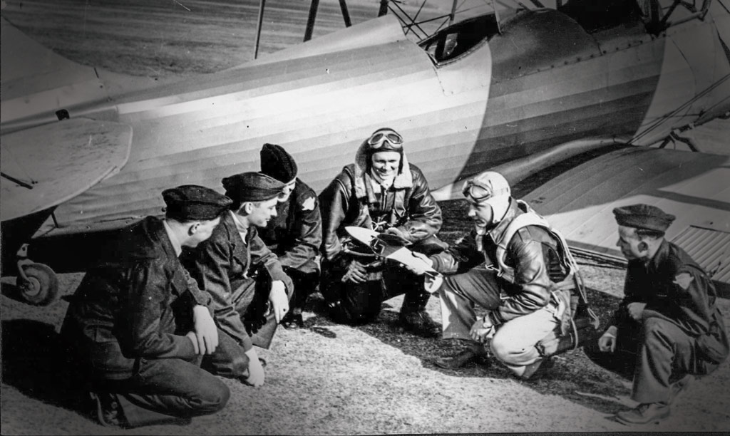 Cadets get ground instruction from Earl Pohlmann at the Pella airport.