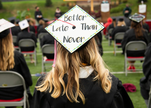 2020 Central graduate with "Better Late Than Never" on her mortarboard.