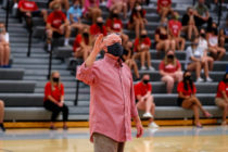 President Mark Putnam greets students during Welcome Week in August 2020 with enthusiasm for learning and safety measures for navigating campus during the pandemic.