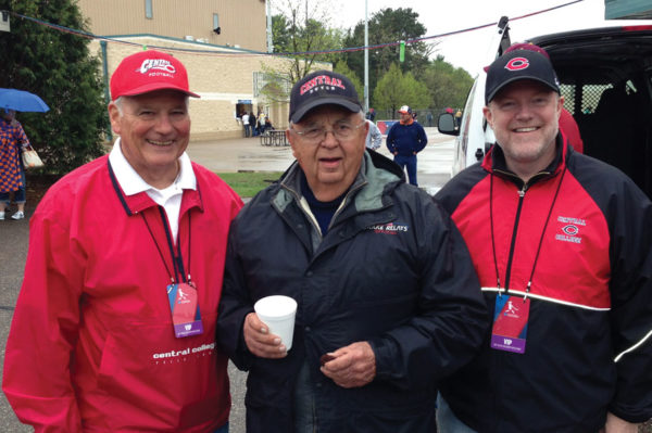 Former Central presidents David Roe (left) and President Emeritus Ken Weller (center) join current President Mark Putnam at the 2013 NCAA Division III softball championships in Eau Claire, Wisconsin.