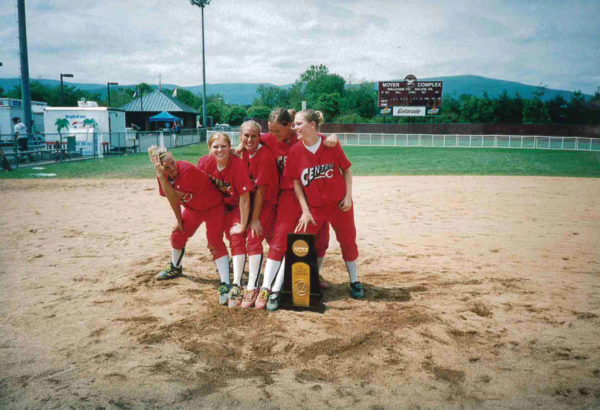 Becky Hedges Pospisal ’04 (center) celebrates Central's 2003 softball national championship.
