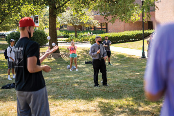 In an effort to promote physical distancing, many faculty and staff chose to teach or work outside when weather permitted, including Eric Jones ’87, class dean, shown here teaching students how to juggle.