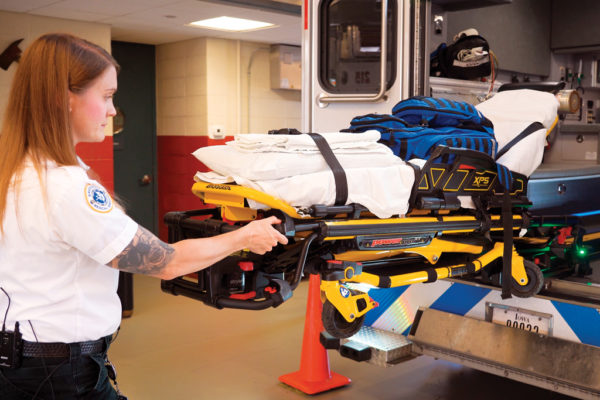 The ambulance contains most of the equipment and supplies to diagnose and stabilize patients in an emergency, including back-saving, powered gurneys. Lisa Schwalenberg Johnson ’07 explains that the blue bag is carried into virtually every call as it has everything needed to start a treatment.