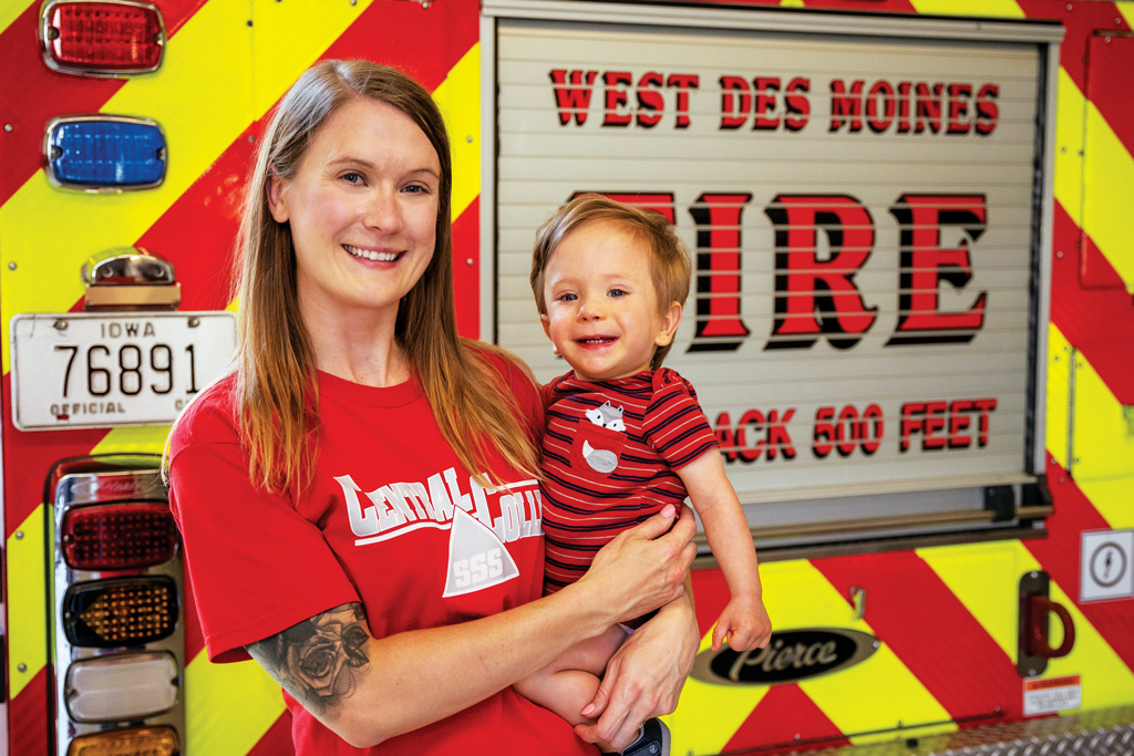 Lisa Schwalenberg Johnson ’07, holding her son Riker, has served as a paramedic with the City of Wes Des Moines Fire and Emergency Services for the past 12 years.