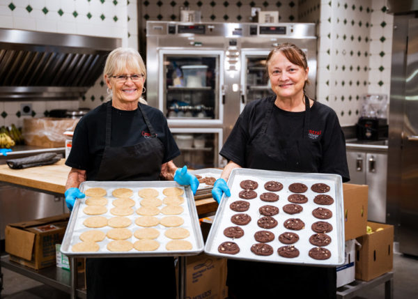 Partners in all things baked at Central Market, Jolene Brooks, bakery/café prep assistant (left), and Wendy LaHue, baker (right), prepare and serve up all the incredible treats students enjoy daily.