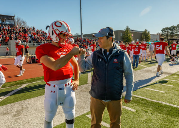 Gagliardi Trophy-winning Central quarterback Blaine Hawkins ’21 shares some final words with the AFCA Division III Coach of the Year Jeff McMartin ’90 before taking the field for Central’s NCAA Division III football playoff game with Wheaton College (Ill.) Nov. 27.