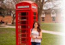 Hailey Swan ’23 with the college’s British phone booth.