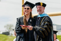 Central College President Mark Putnam, with 2022 graduate Abigail Lowry.