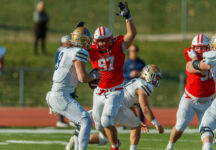 Matt Glockel '21 makes a play during a football game versus Bethel University.