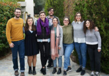 Kat De Penning '11, third from left, poses on campus with students from Greek Bible College.