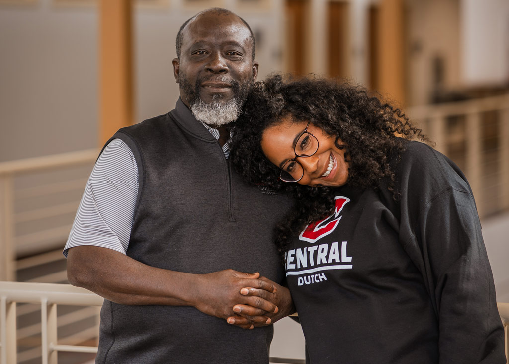 Beatriz Mate-Kodjo ’11, right, takes a playful break from work with her father, Samuel Mate-Kodjo, associate professor of Spanish, in the Weller Center for International Studies on Central’s campus.
