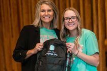 Jen Diers, director of the education program at Central College, and Kinsley Parrott ’21, founder and president of Packs for a Purpose, Inc., proudly present one of the nonprofit’s packs.