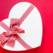 Graphic of a heart with a red bow