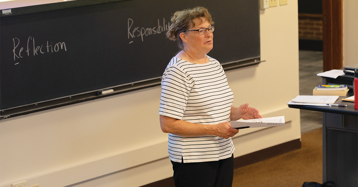 Lori Witt reviewing Engaged Citizenship curriculum with class